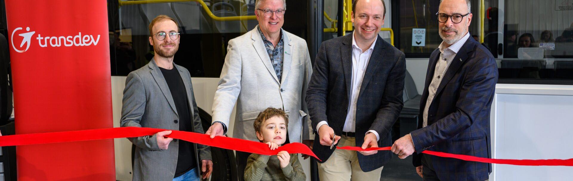 Inauguration facility in Beloeil, Canada with people cutting a ribbon