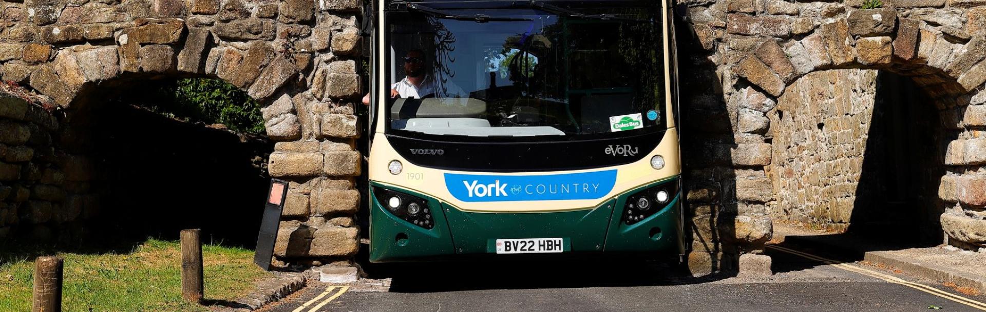 Transdev driver Wayne Moody calmly guides his bus through Yorkshire’s Bolton Abbey arch – just 9 ft 5 inches wide – as images of him completing the task without a scratch go viral on social media