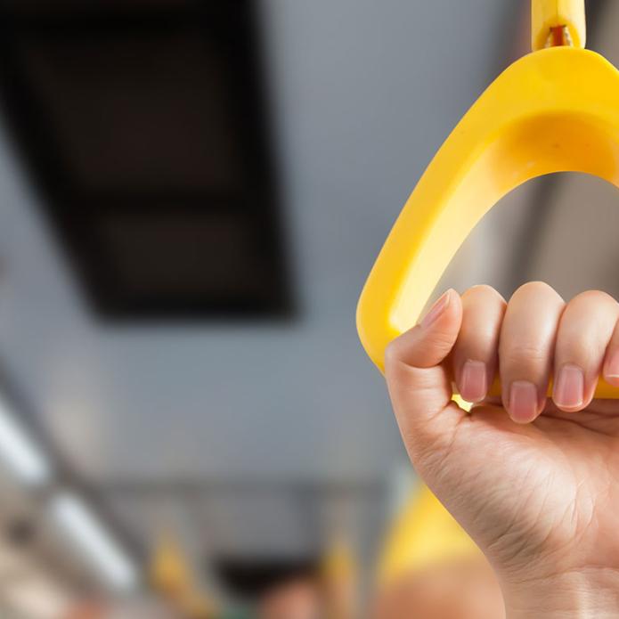 A hand holding the bus