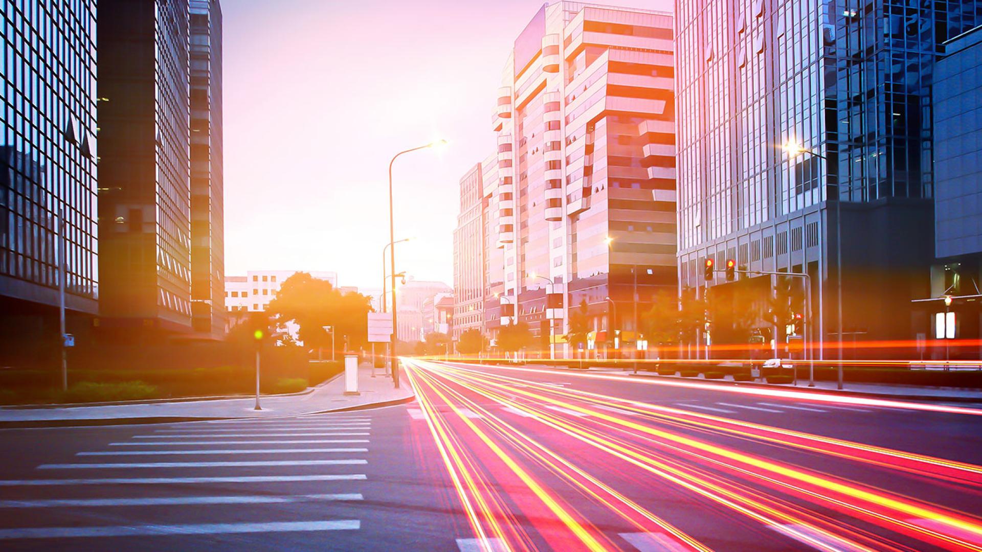 Fast cars on the road creating neons