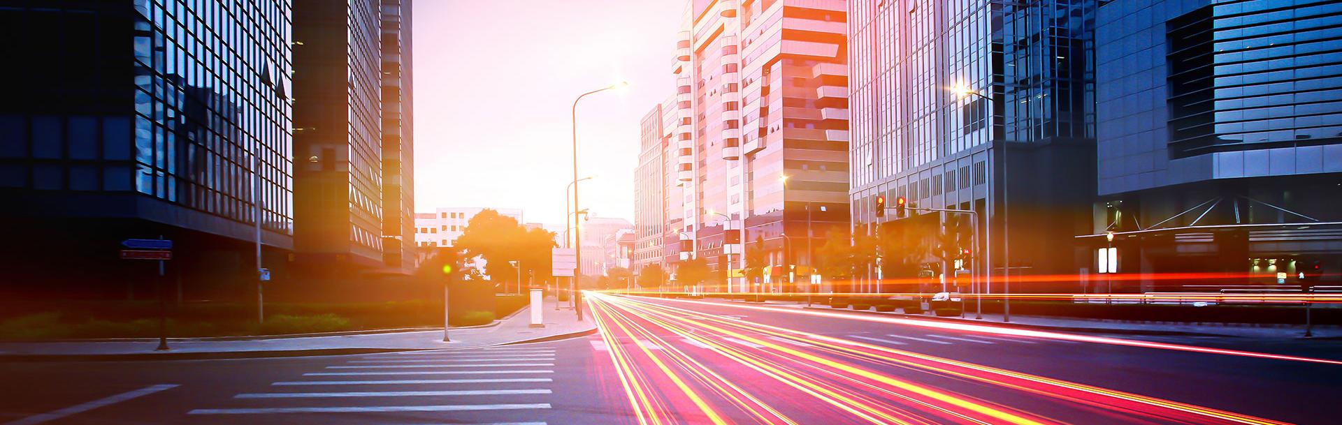 Fast cars on the road creating neons