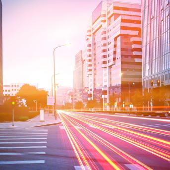 Fast cars on the road creating neons