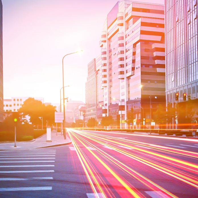 Fast cars on the road creating neons