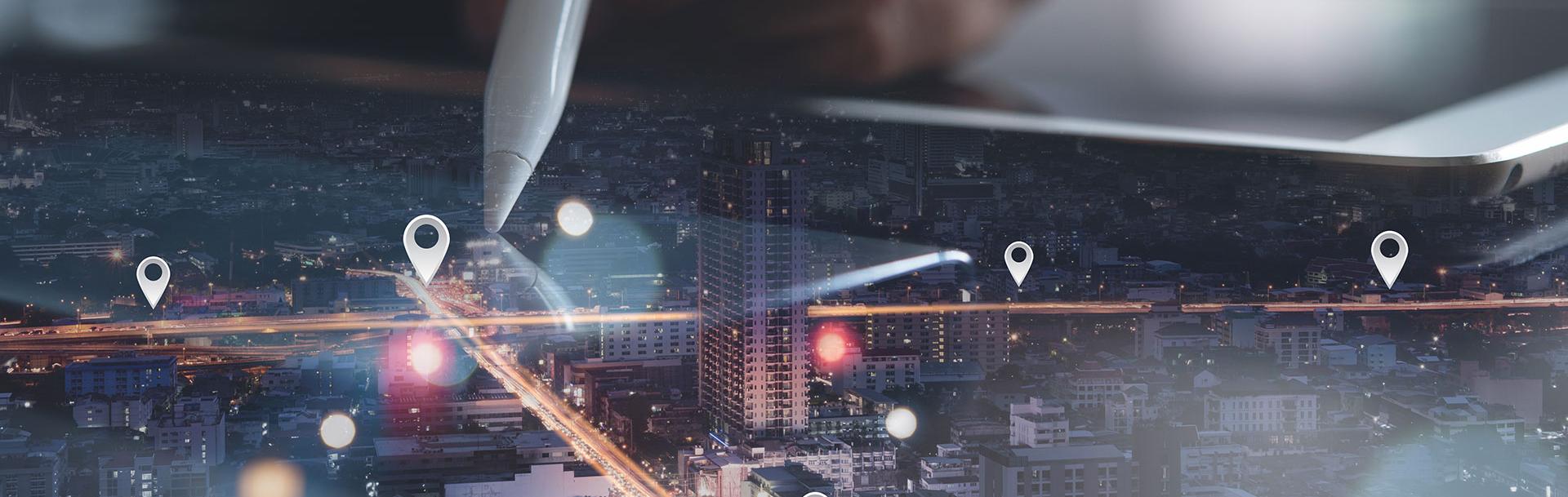 A pen on a map with a city landscape