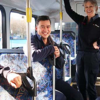 Transdev Australia gender equality with men and women staff in a bus