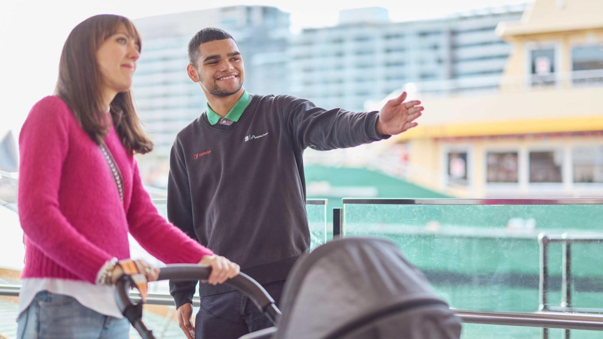 Woman pushing a pram asking for directions