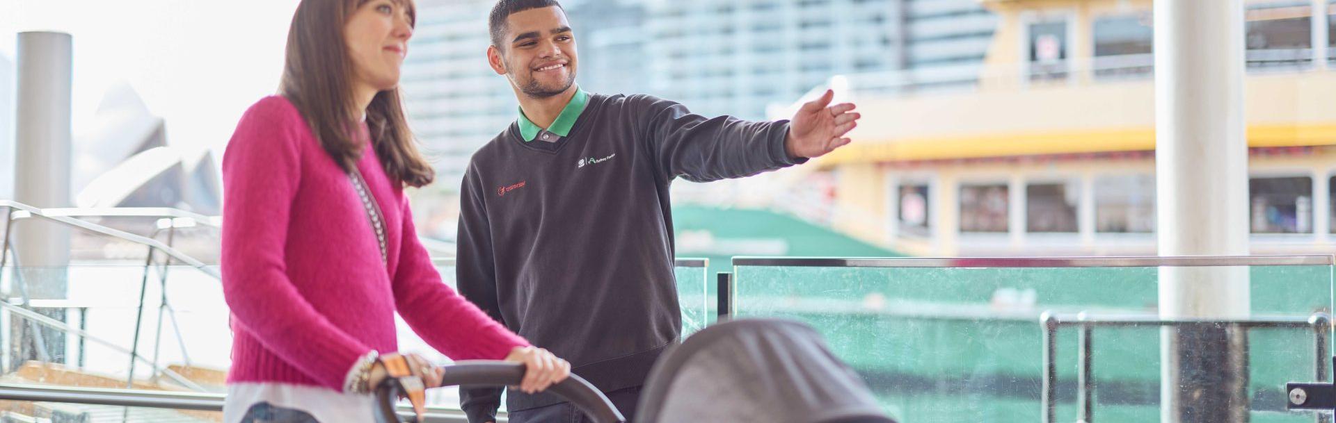 Woman pushing a pram asking for directions