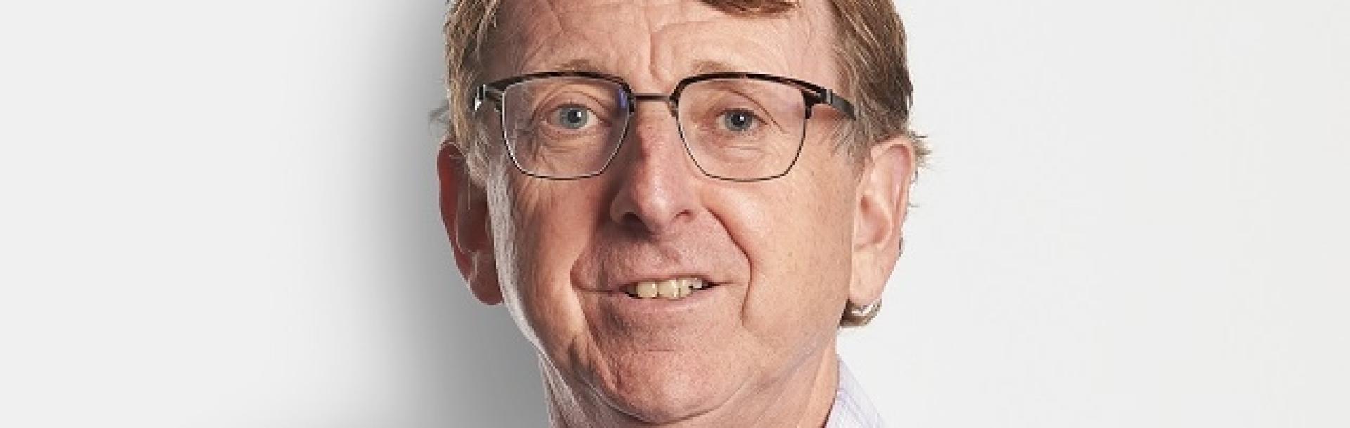 man smiling sitting in a bus