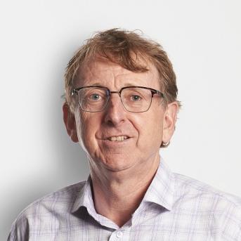 man smiling sitting in a bus