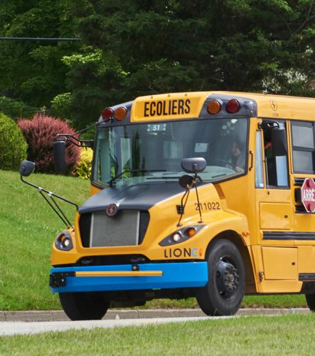 Yellow school bus for student transport in Boucherville, Quebec, operated for safe and reliable service