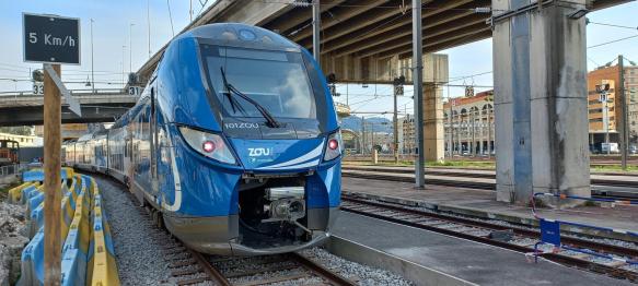 Blue ZOU regional train stopped on the tracks at Nice train station, France.