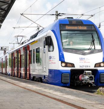 Regional passenger train stopped at a station platform
