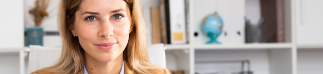 female company director, fair-haired and smiling