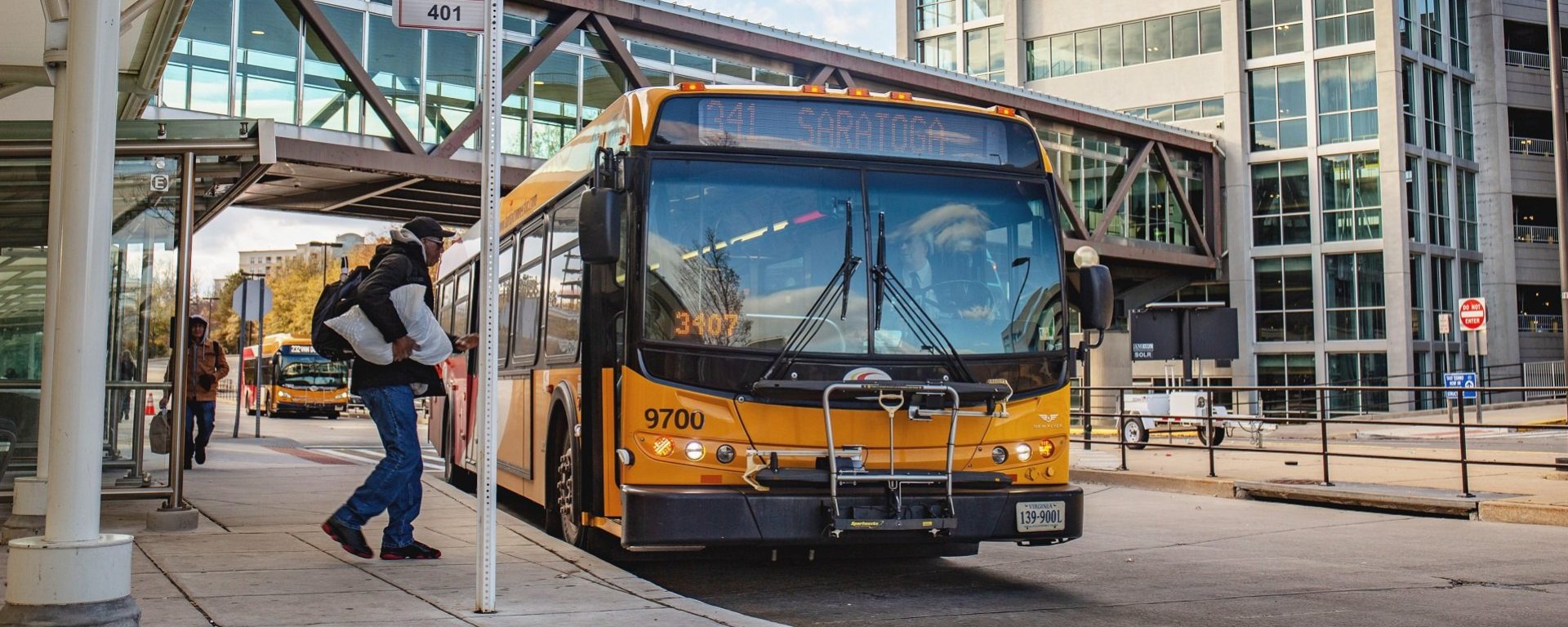 passenger yellow bus Fairfax connector county Transdev north america public transit mobility