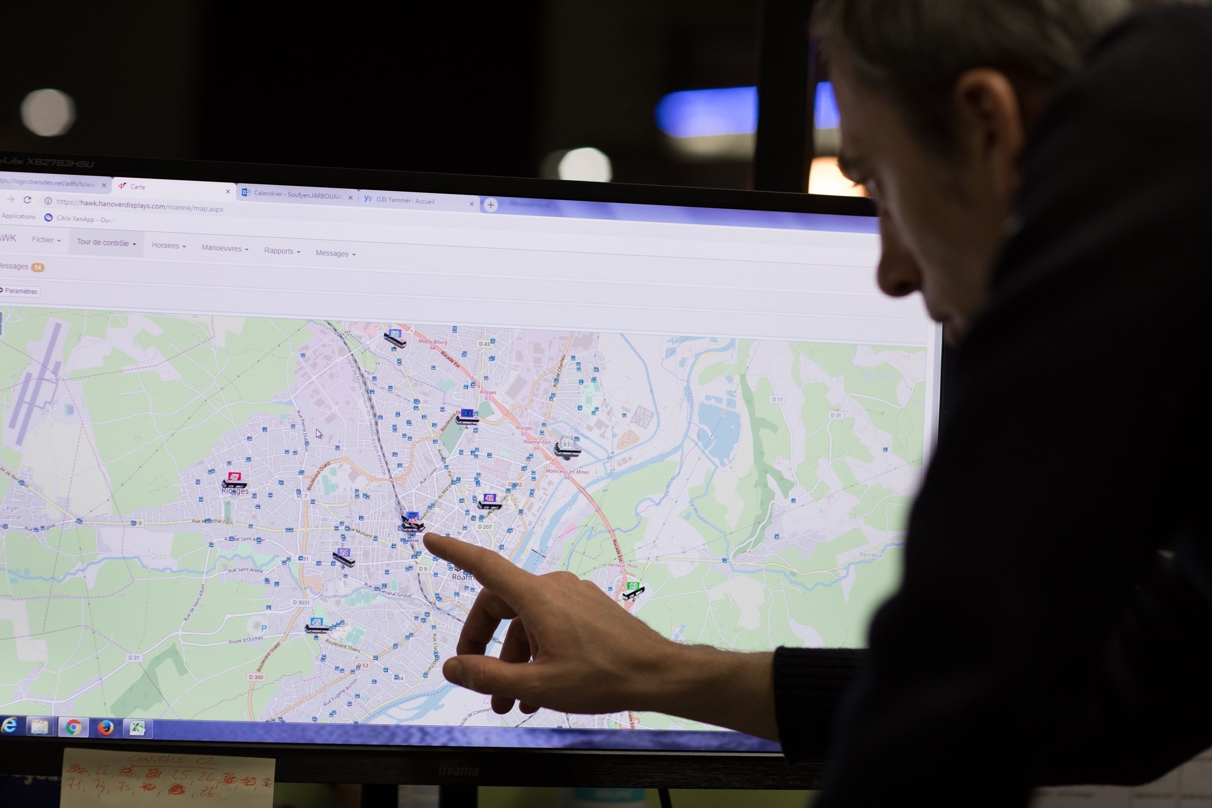 a man pointing to a city map transport network